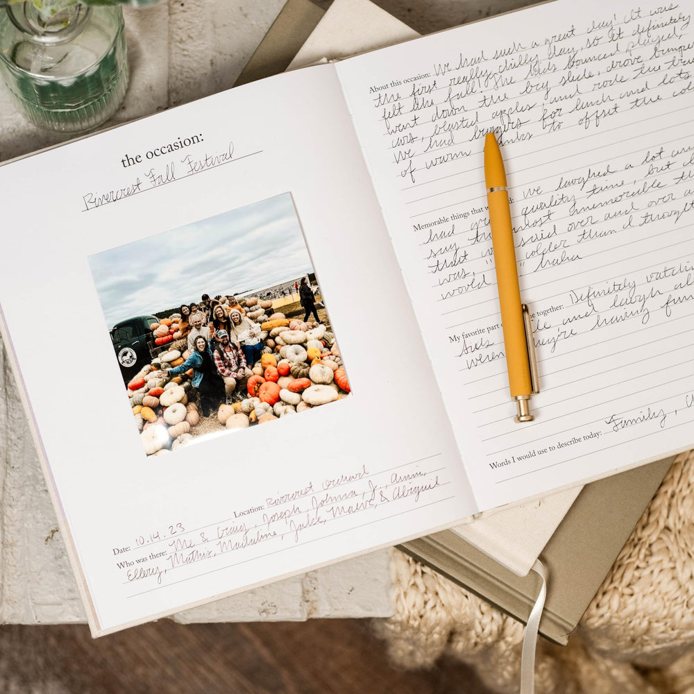 Duncan & Stone memory book 30 occasions layout captures milestones and photos.