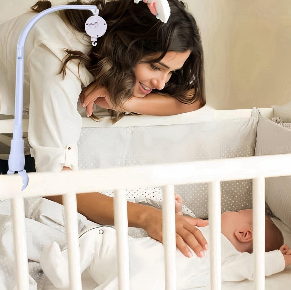 Dwwffer baby-sleep décor image shows decorative rail attachment for gentle ambiance.