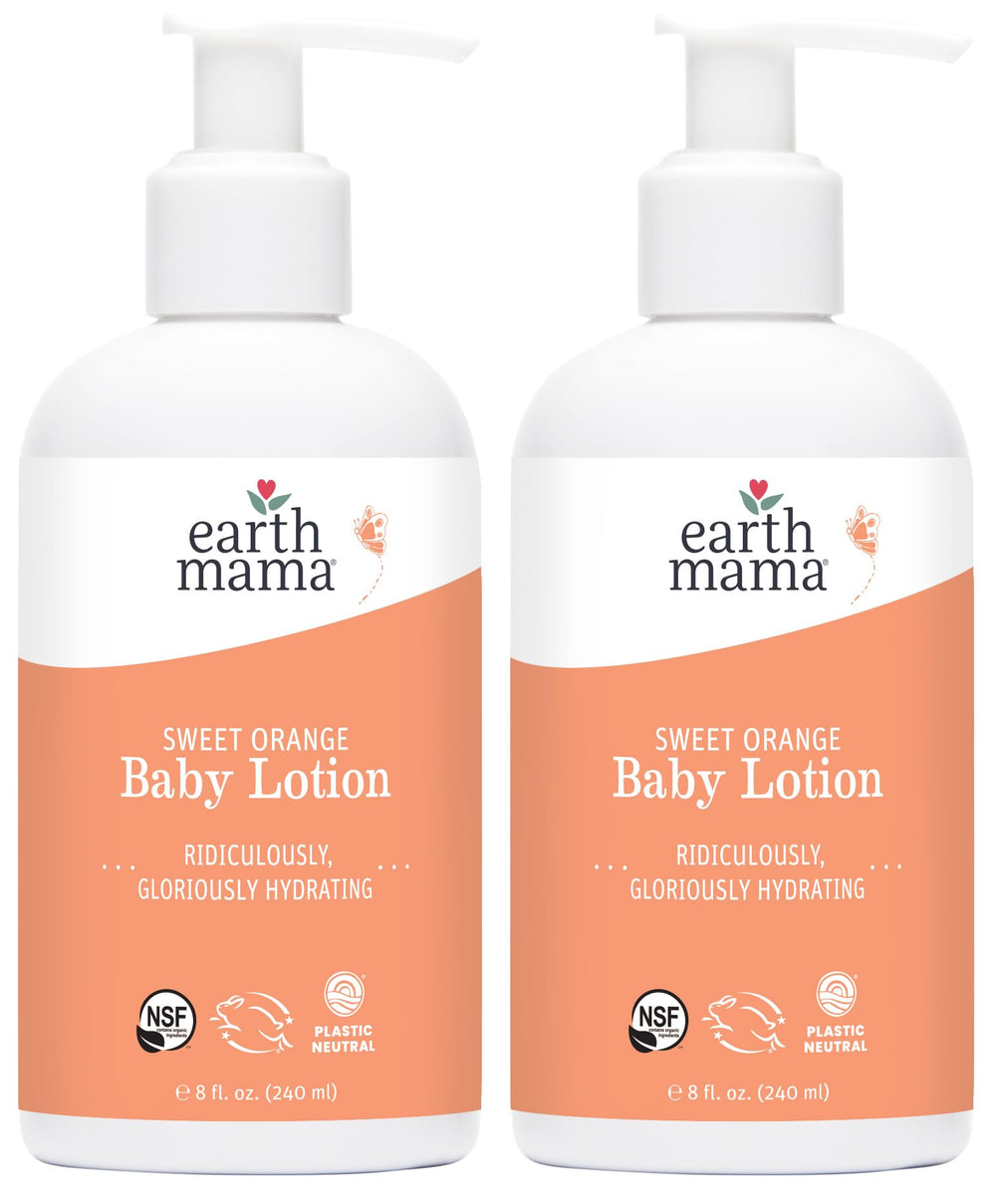 Earth Mama Sweet Orange Baby Lotion bottle on table, gentle daily moisture.