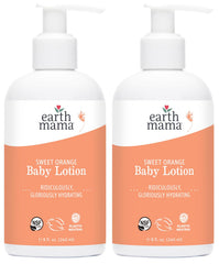 Earth Mama Sweet Orange Baby Lotion bottle on table, gentle daily moisture.