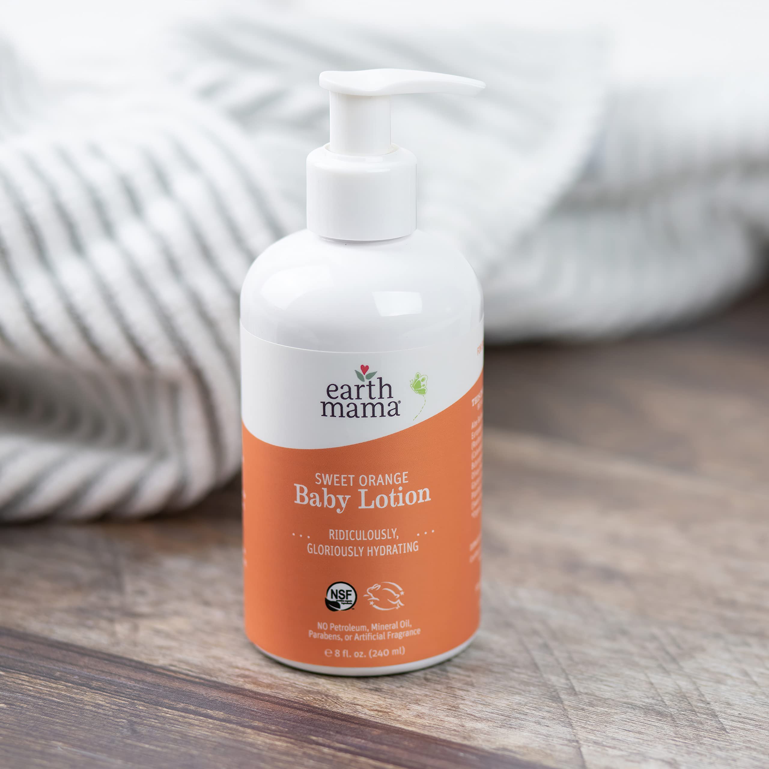 Earth Mama Sweet Orange Baby Lotion Leaping Bunny logo showcased.