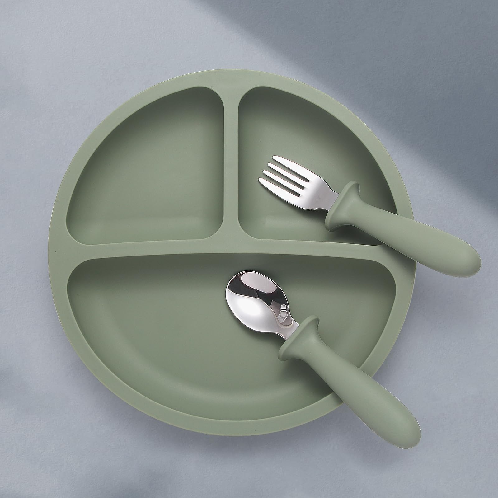 Eascrozn colorful baby plates on a high chair engaging in independent eating.