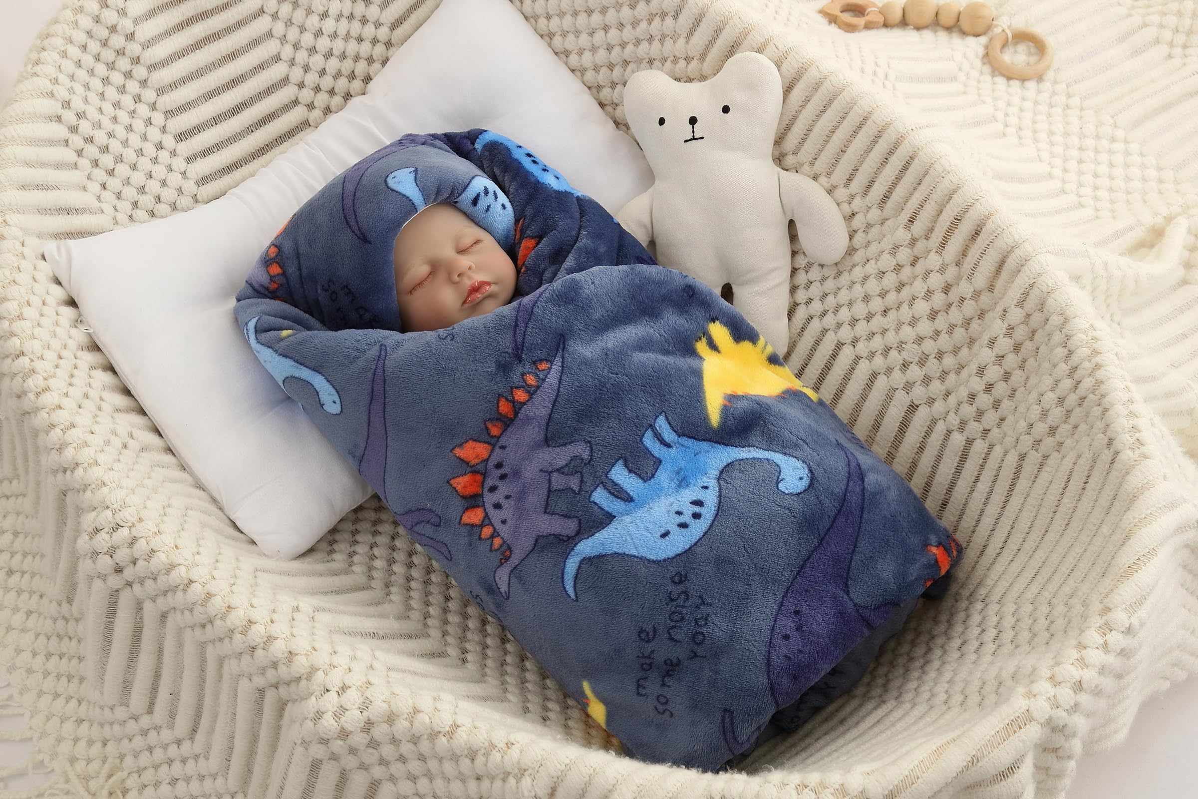 ECHERY navy-dinosaur blanket shown in bed and car seat transitions.