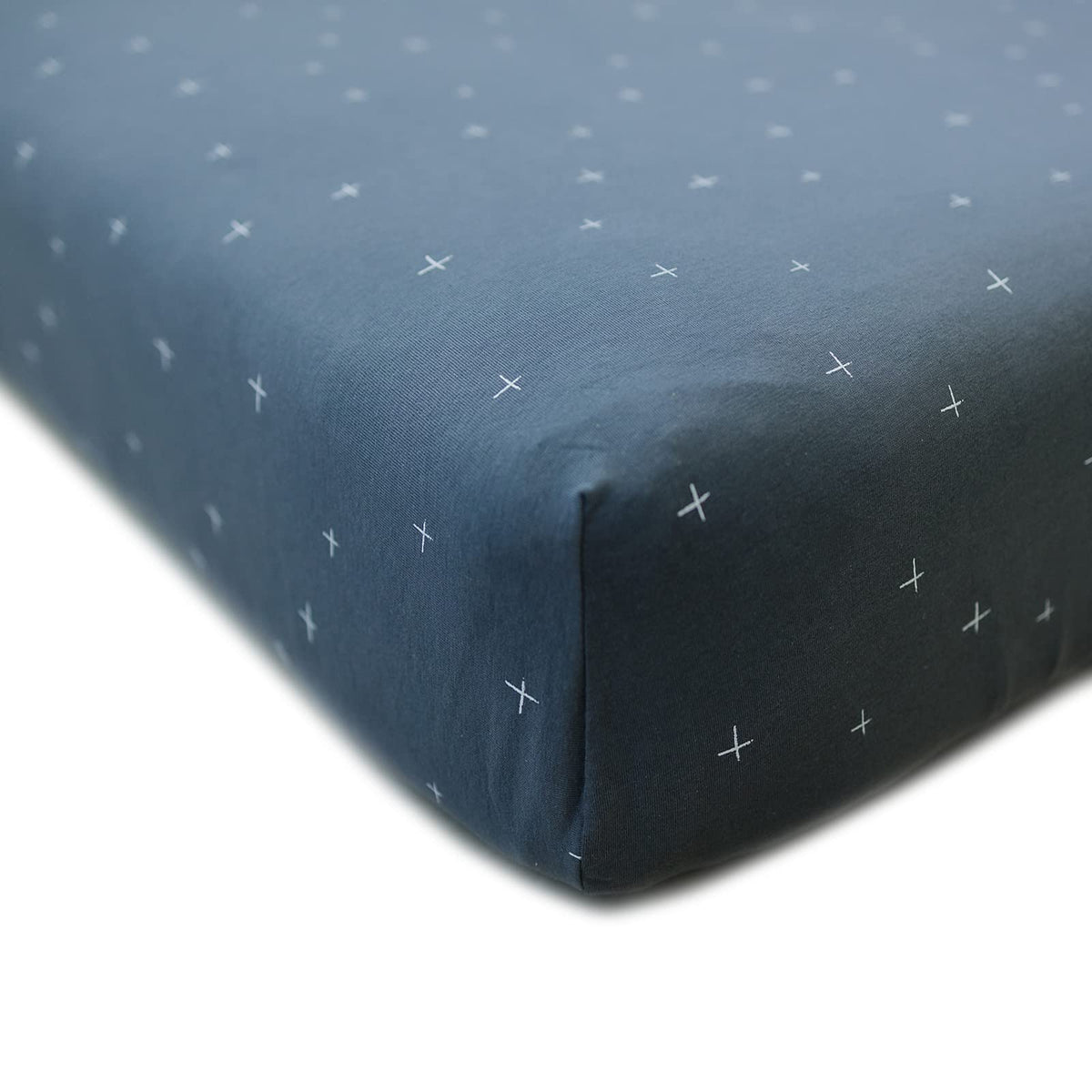 Ecolino fitted crib sheet in slate twinkle on a standard mattress for a snug fit.