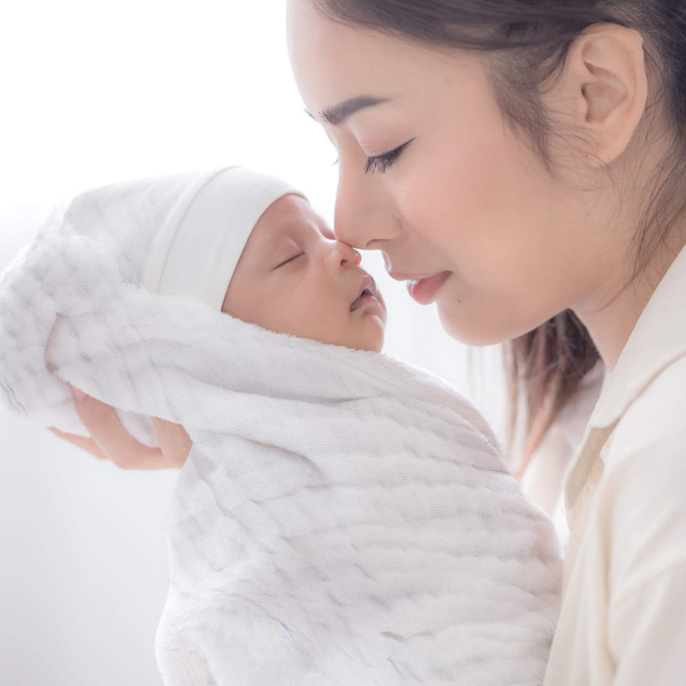 ECOVONA muslin burp cloths on crib or stroller to keep surfaces clean
