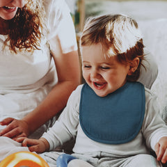 Egmao Baby bibs on a toddler outfit showing secure fit and style