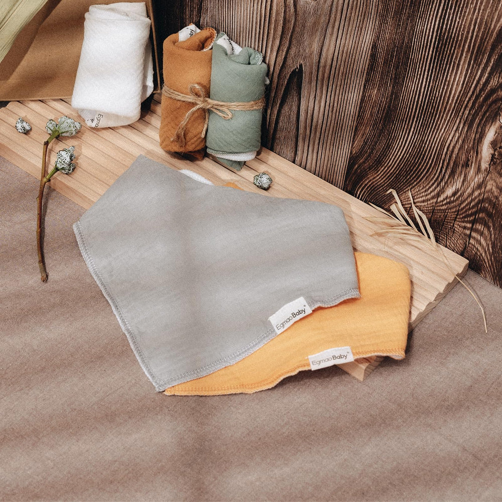 Egmao Baby bibs protect clothing during burping and mealtime messes.