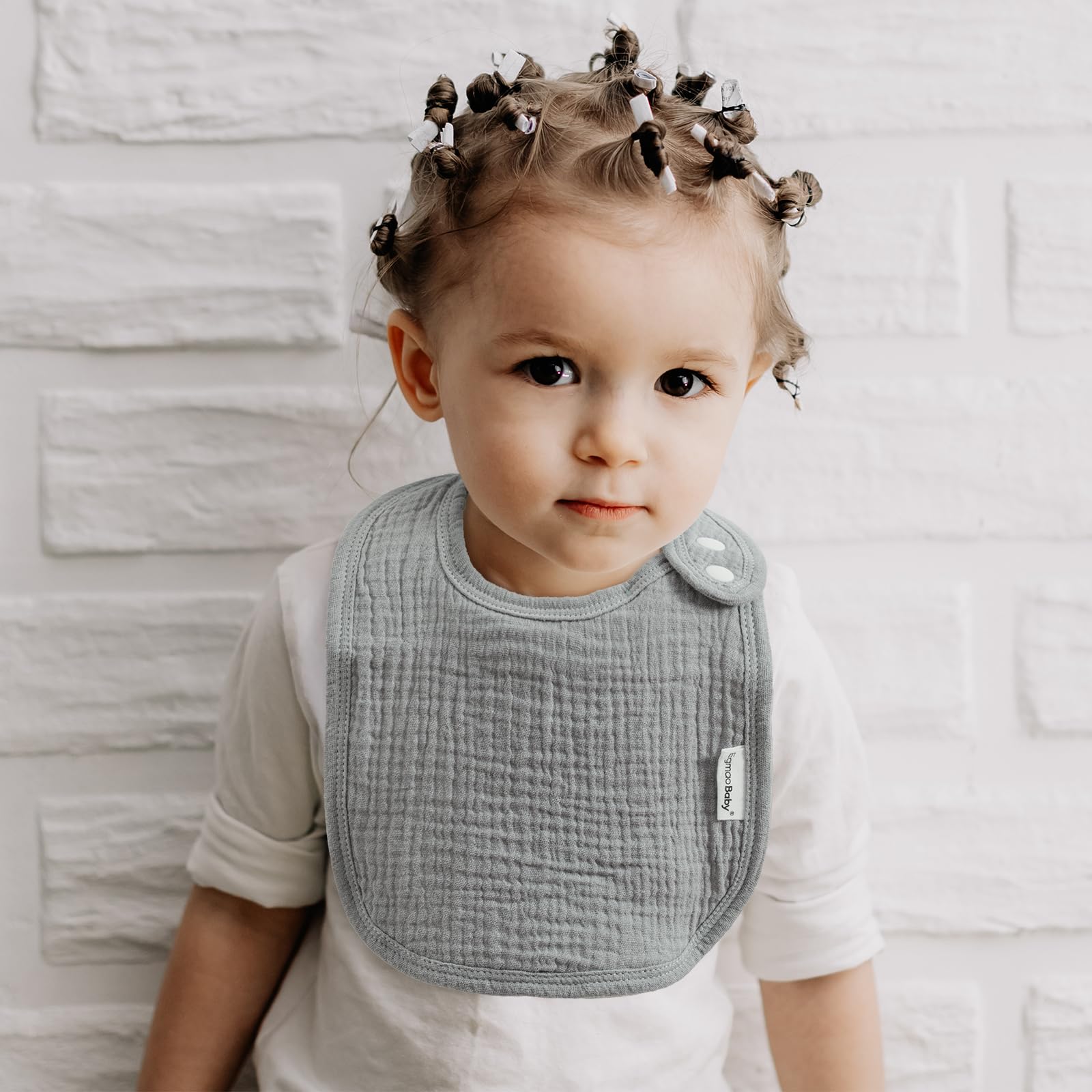 Egmao Baby Muslin Bib colorful designs on-pack showcased for stylish outfits