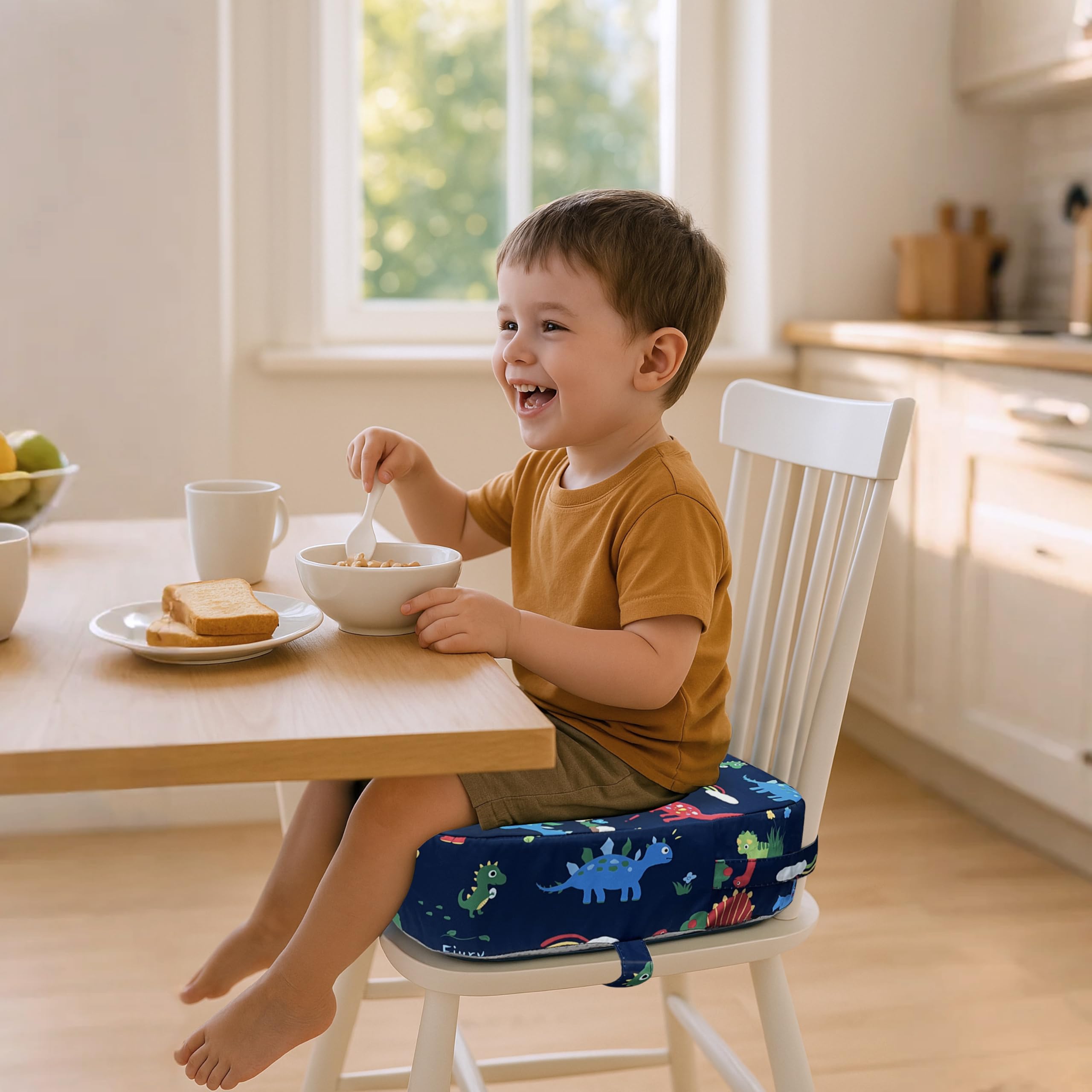 Eiury toddler booster seat blue dinosaur in-use at dining table