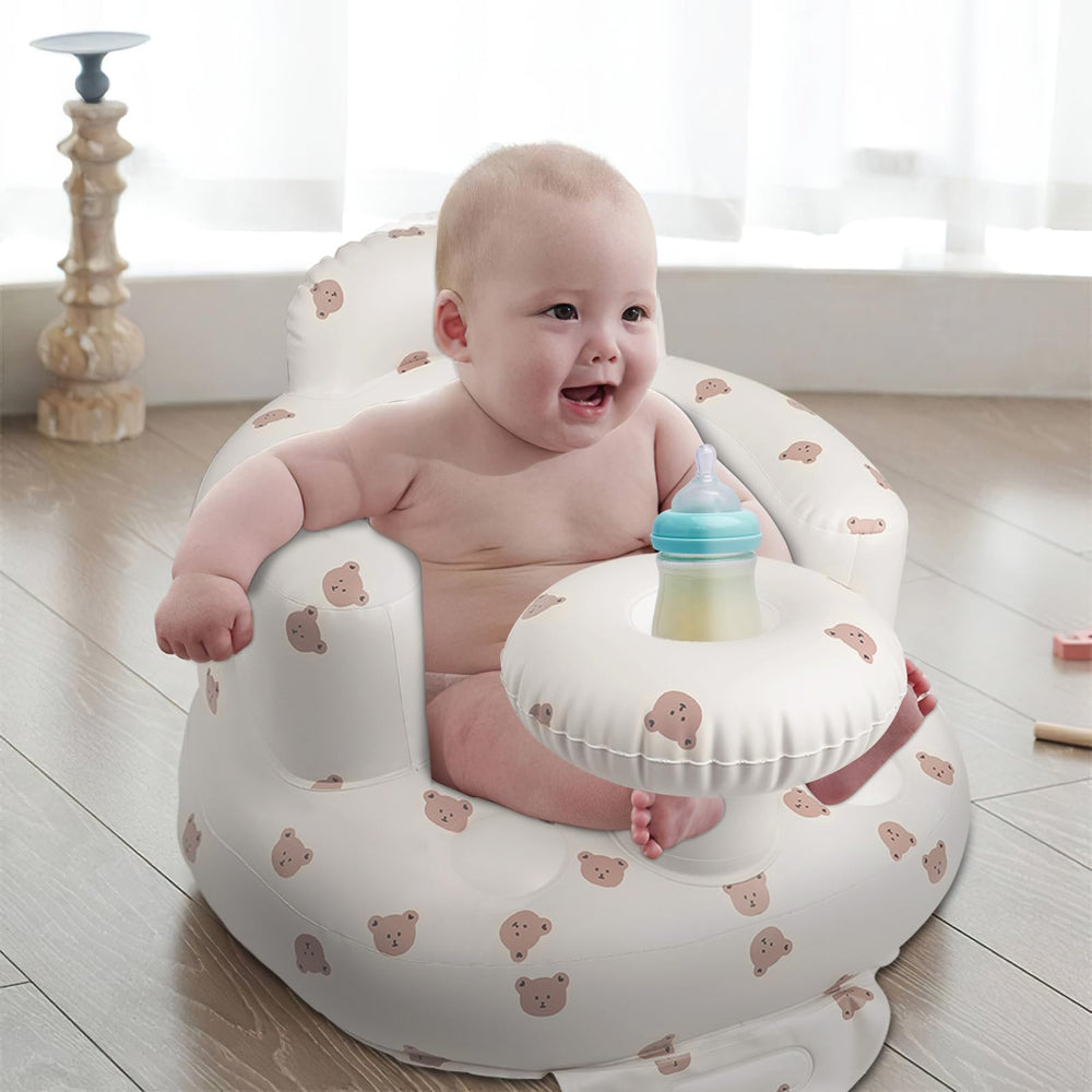 EKEPE baby seat built-in tray keeps a bottle within reach during snacks.