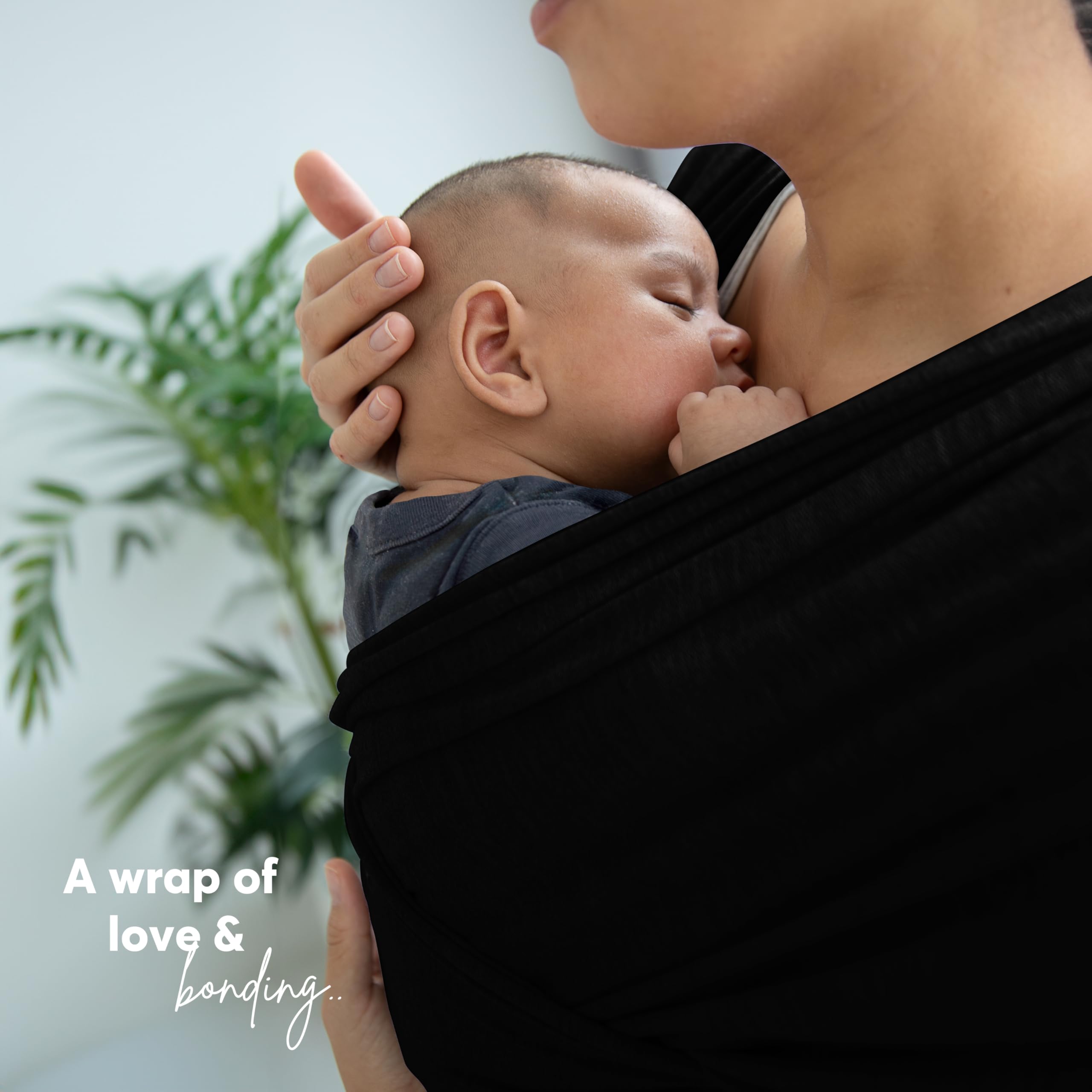 ELDOMA Black Baby Wrap Carrier outdoor stroll supports hands-free convenience.