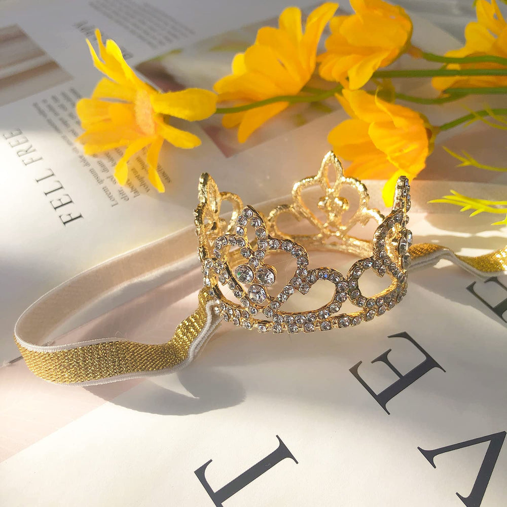 ELEMIRSA baby crystal crown gold detailed stones highlight tiny smiles in photoshoots.