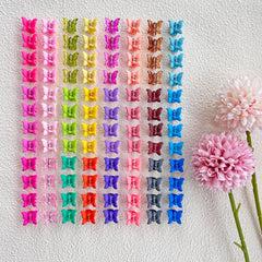 Elemirsa butterfly-shaped clips adding cute detail to toddler hairstyles.