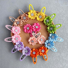Elesa Miracle 2-inch flower clip closeup showing secure snap clip for gentle hold