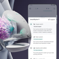 Elvie hands-free wearable pump in bra during meeting for flexibility.