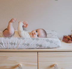 Ely's & Co Changing Pad Cover elastic band fit demonstrates snug, adaptable coverage across pads