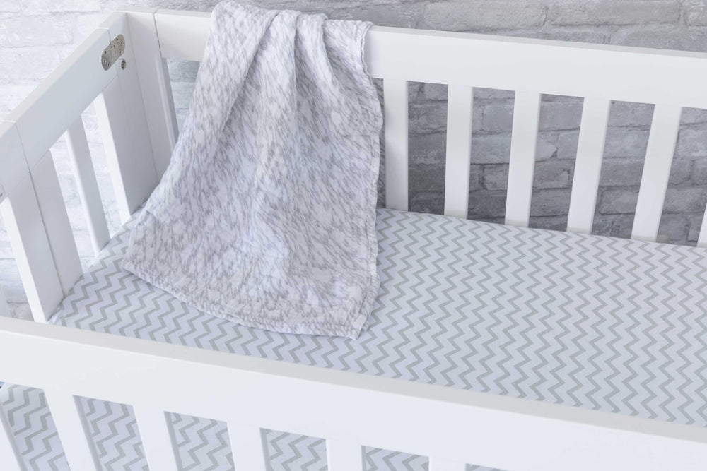 Ely's & Co 2-pack crib sheets showcase two coordinated prints for easy mix-and-match.
