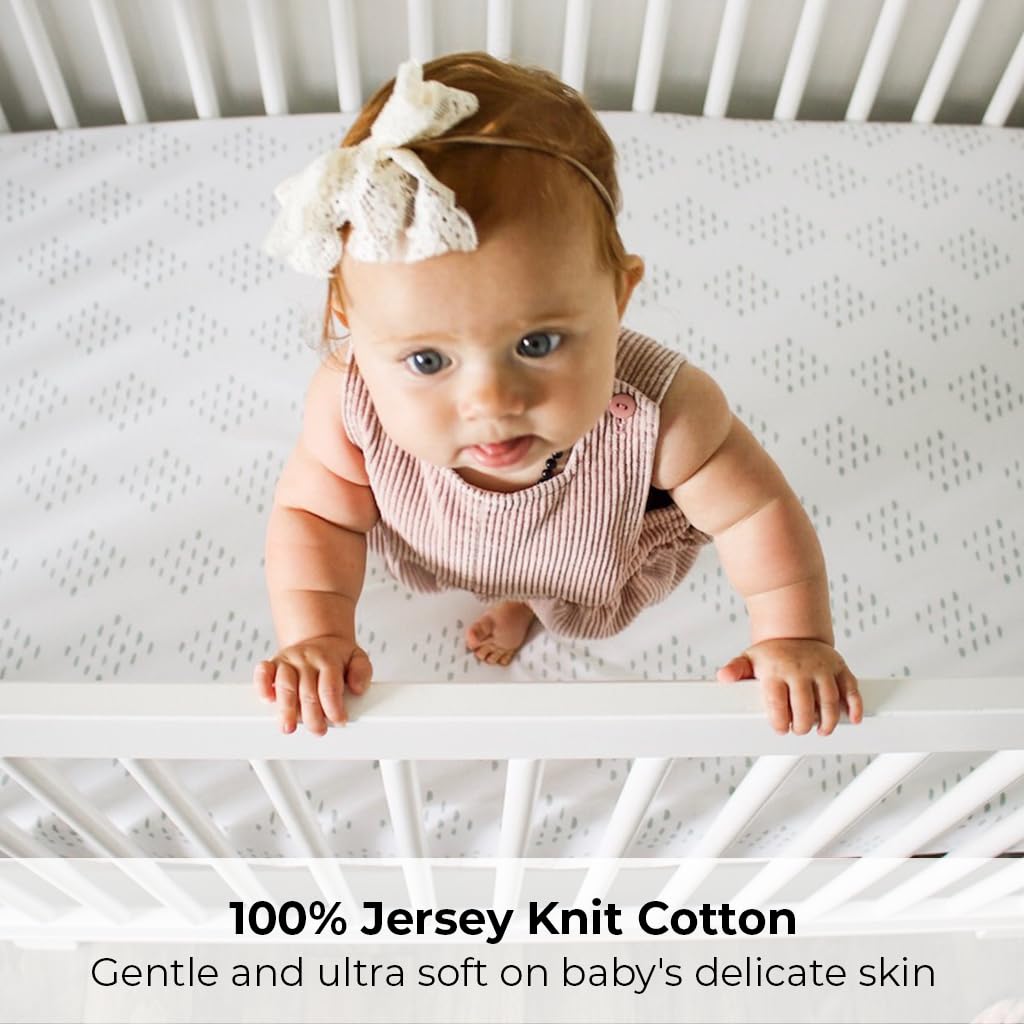 Ely's & Co. fitted sheet shows secure elastic-fit band for snug playard fit