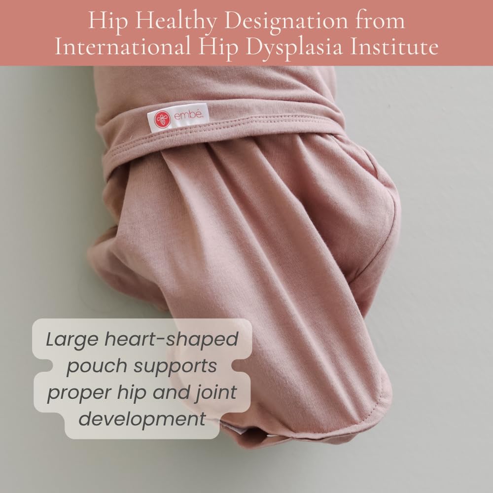 embé newborn sleep scene shows secure wrap promoting calm rest.