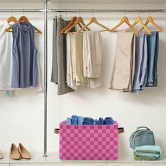 Emelivor pink checkered storage bin with toys neatly organized in nursery.