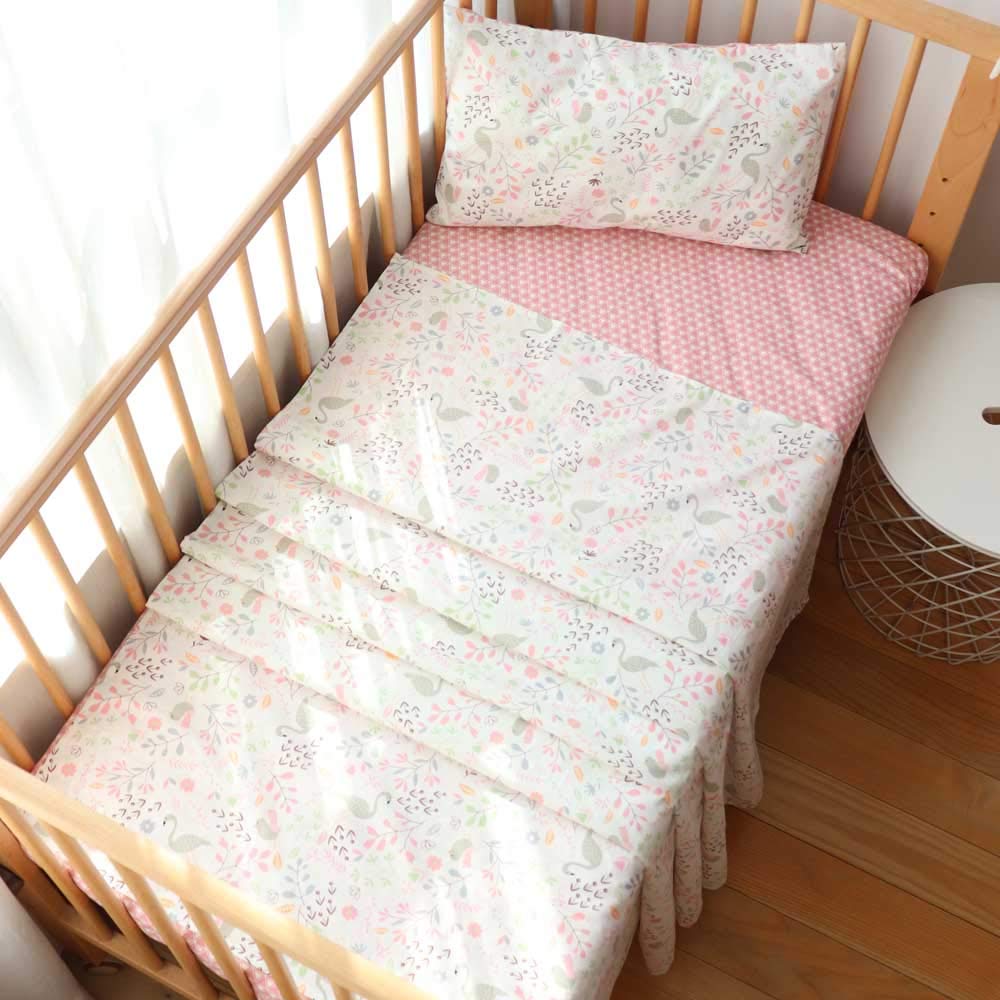 Emenpy Swan pattern crib sheet shows soft cotton for gentle toddler sleep