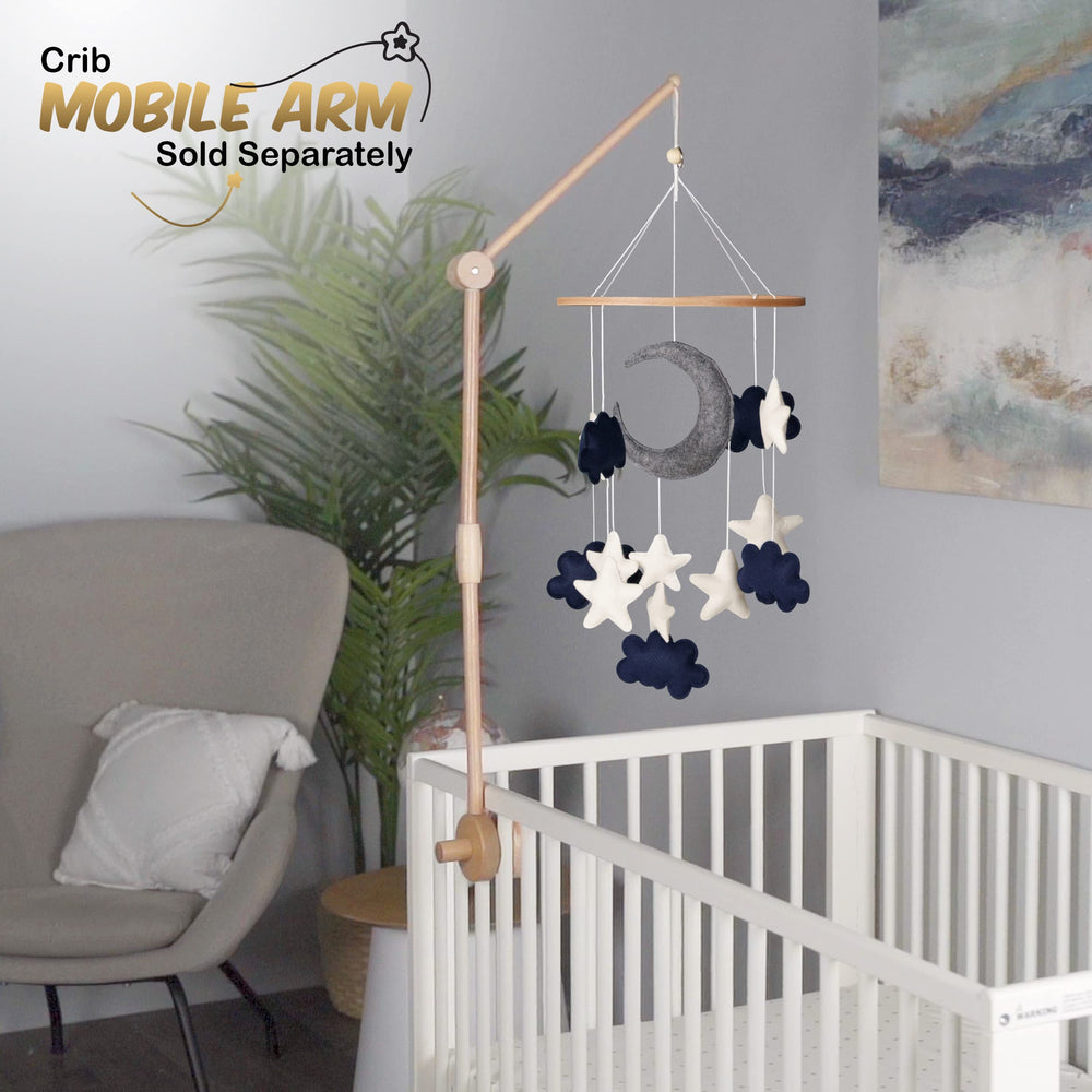 EMMNNIC baby-mobile white clouds visuals create a serene crib focal point.