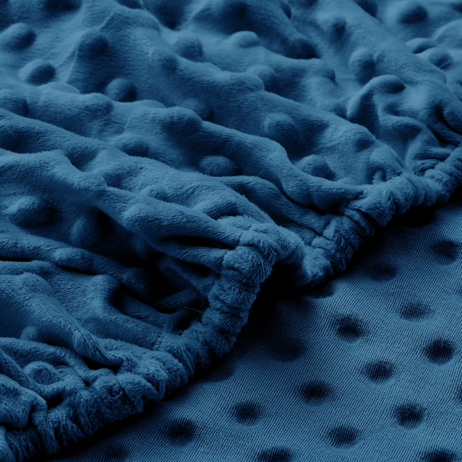 Entisn bassinet sheet's minky dot texture adds gentle tactile comfort.