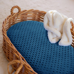Entisn bassinet sheet fits oval mattresses with a secure 4-inch deep pocket.