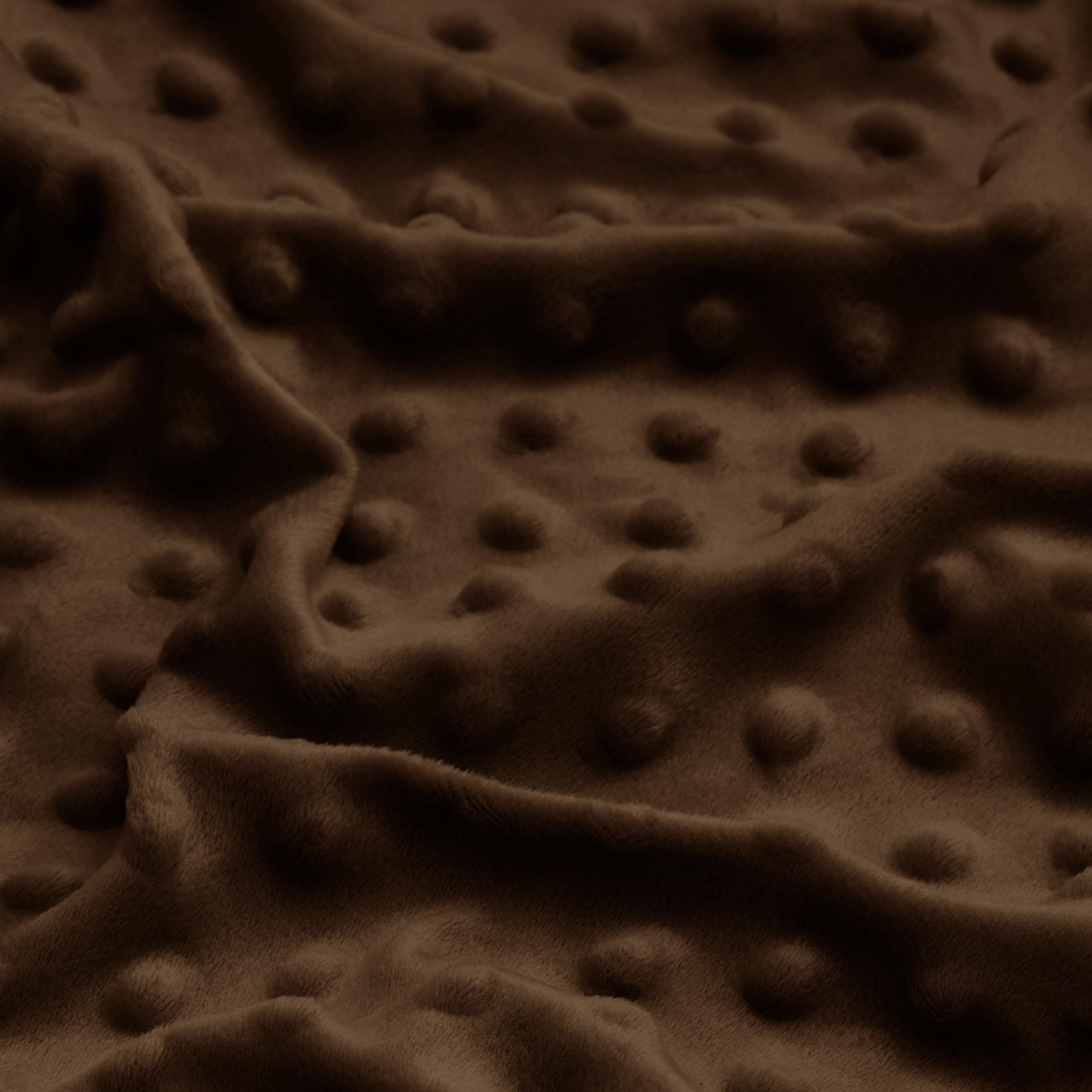 Entisn mini crib sheet in chocolate brown demonstrating snug fit and full coverage