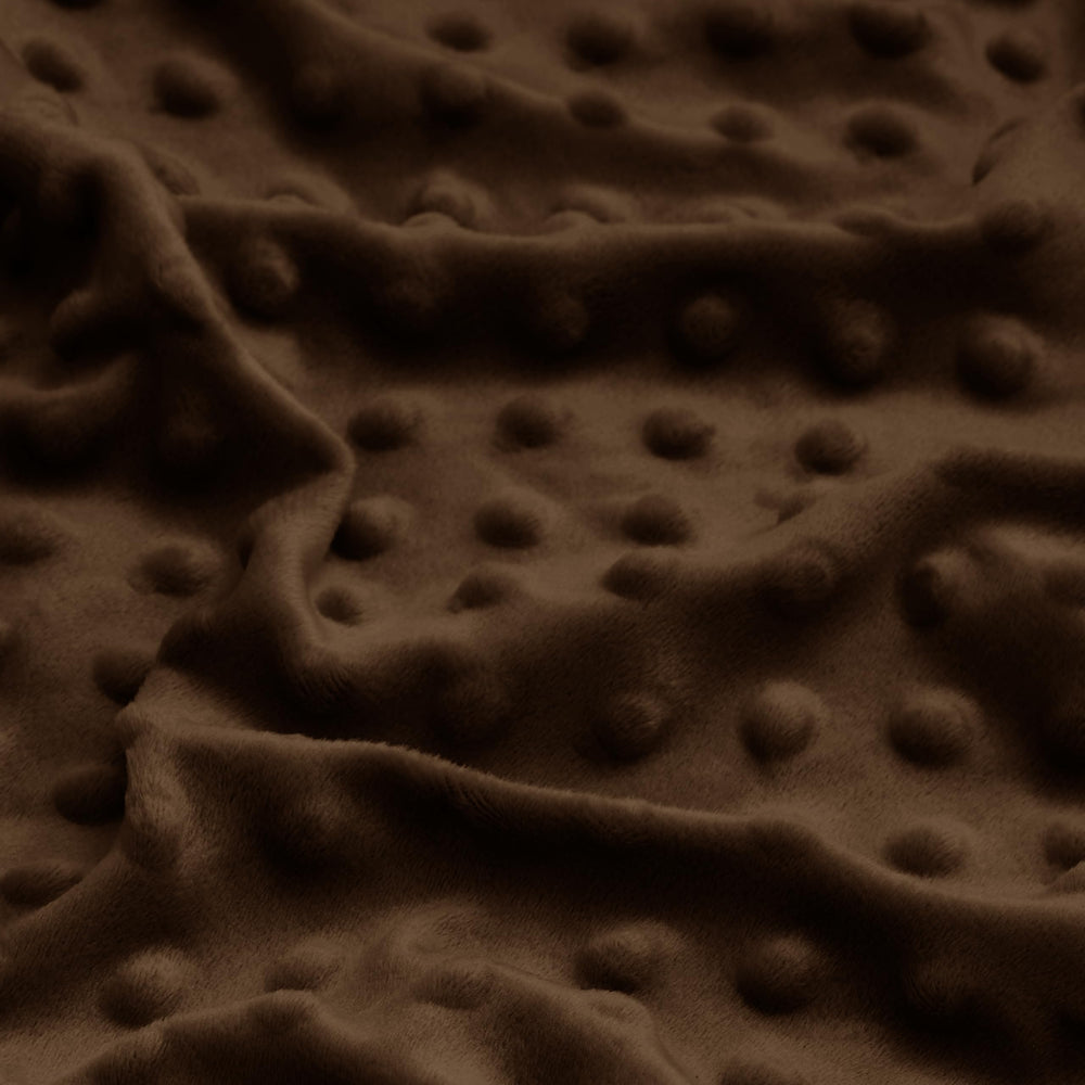 Entisn mini crib sheet in chocolate brown demonstrating snug fit and full coverage
