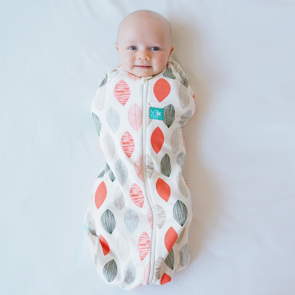 ergoPouch cocoon swaddle sack on baby with arms-in snug sleep