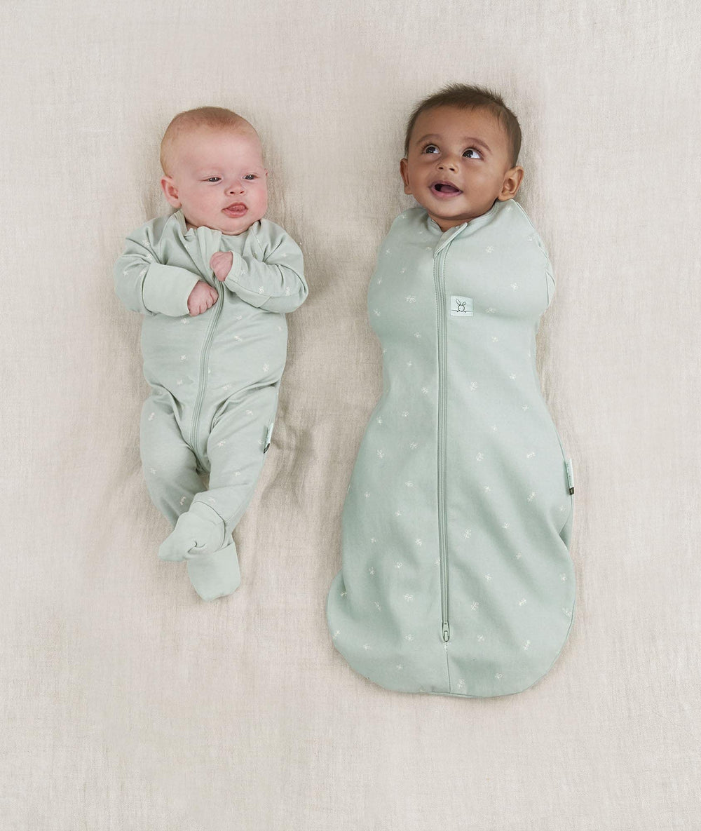 ergoPouch Cocoon Swaddle Sack side view highlights arms-in to arms-out transition