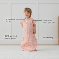 ergoPouch Sleep Suit Bag daisies car-seat-fit shows secure travel with a 5-point harness