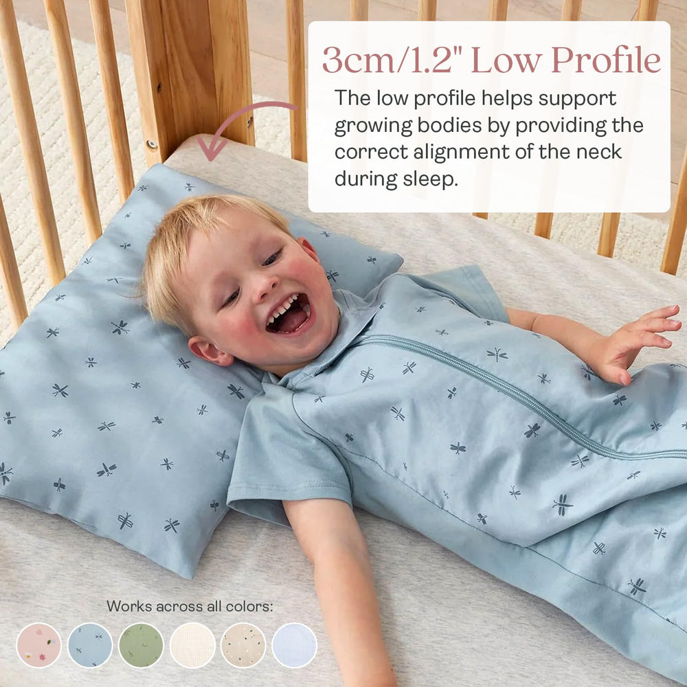 ergoPouch pillow in toddler bed shows low-profile 1-inch neck-support design.