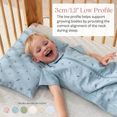 ergoPouch pillow in toddler bed shows low-profile 1-inch neck-support design.