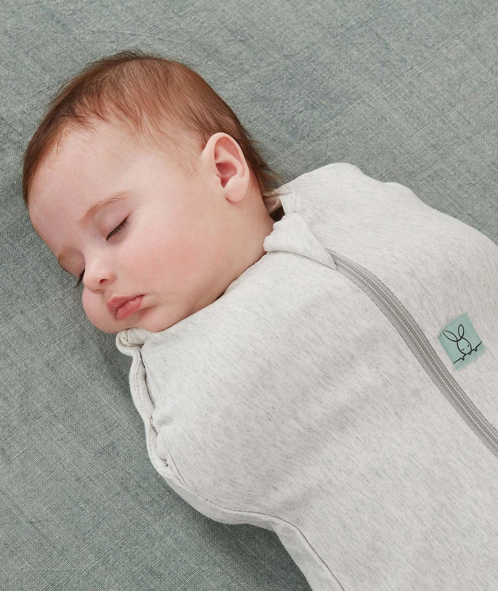 ergoPouch Cocoon Swaddle Sack arms-in to arms-out transition shows adjustable sleep setup