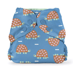 Esembly cloth diaper cover snapped over absorbent inner showing blowout protection and containment.