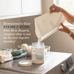 Esembly powder scoop next to canister aids precise, mess-free measuring.