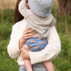 Esembly outer features adjustable snaps to customize waist and leg fit for comfort.