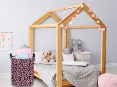 Essme pink leopard-print hamper closeup highlighting decorative pattern that won't stain easily.