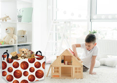 Essme rectangular basket in living room organizing magazines and toys.