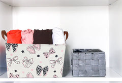 Essme bowknot pink basket with cotton rope handles enables easy room-to-room movement.