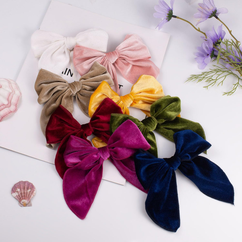 Esumun eight-color velvet bows versatile for school wear and party looks.
