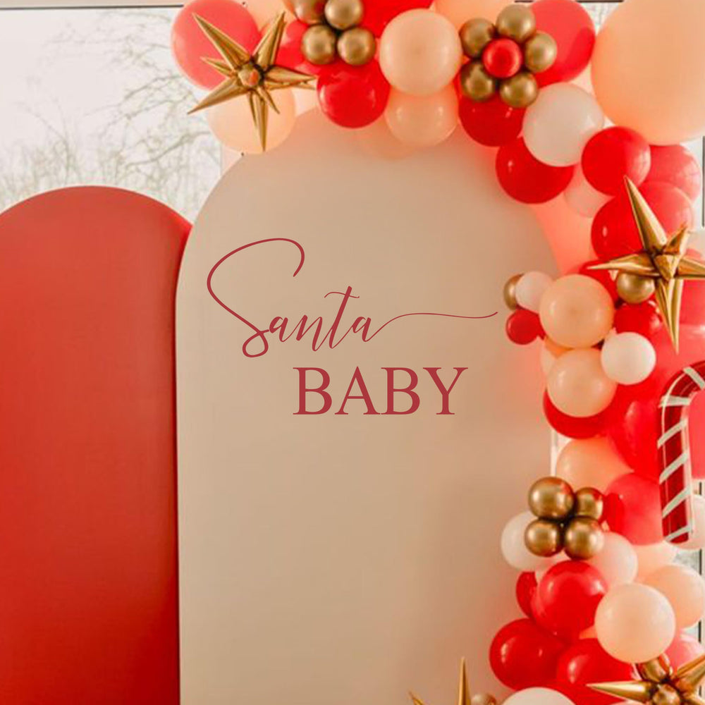 Eurteka Santa Baby Decal wall-backdrop transforms spaces into a winter wonderland.