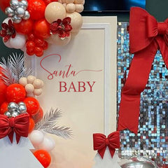 Eurteka Santa Baby Decal photo backdrop enhances baby shower memories.