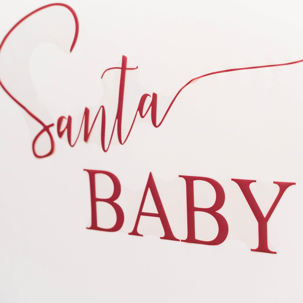 Eurteka Santa Baby Decal seasonal decor pairs with other Christmas supplies.