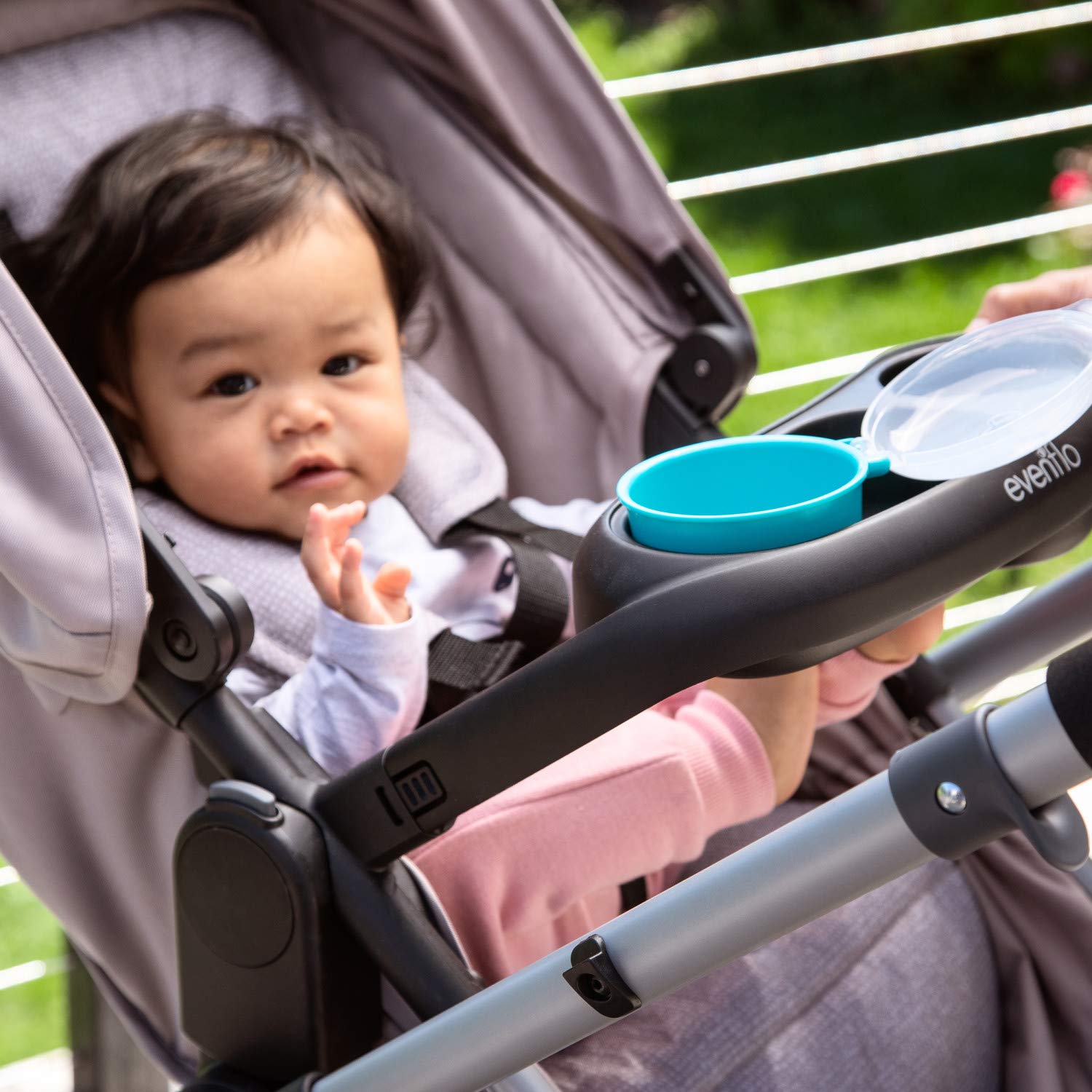Evenflo stroller snack tray attaches and detaches for simple setup.