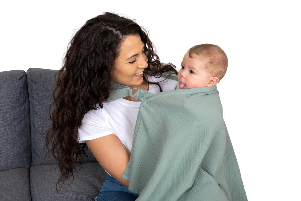 Evergrwn nursing cover includes built-in burp cloths for quick cleanup.