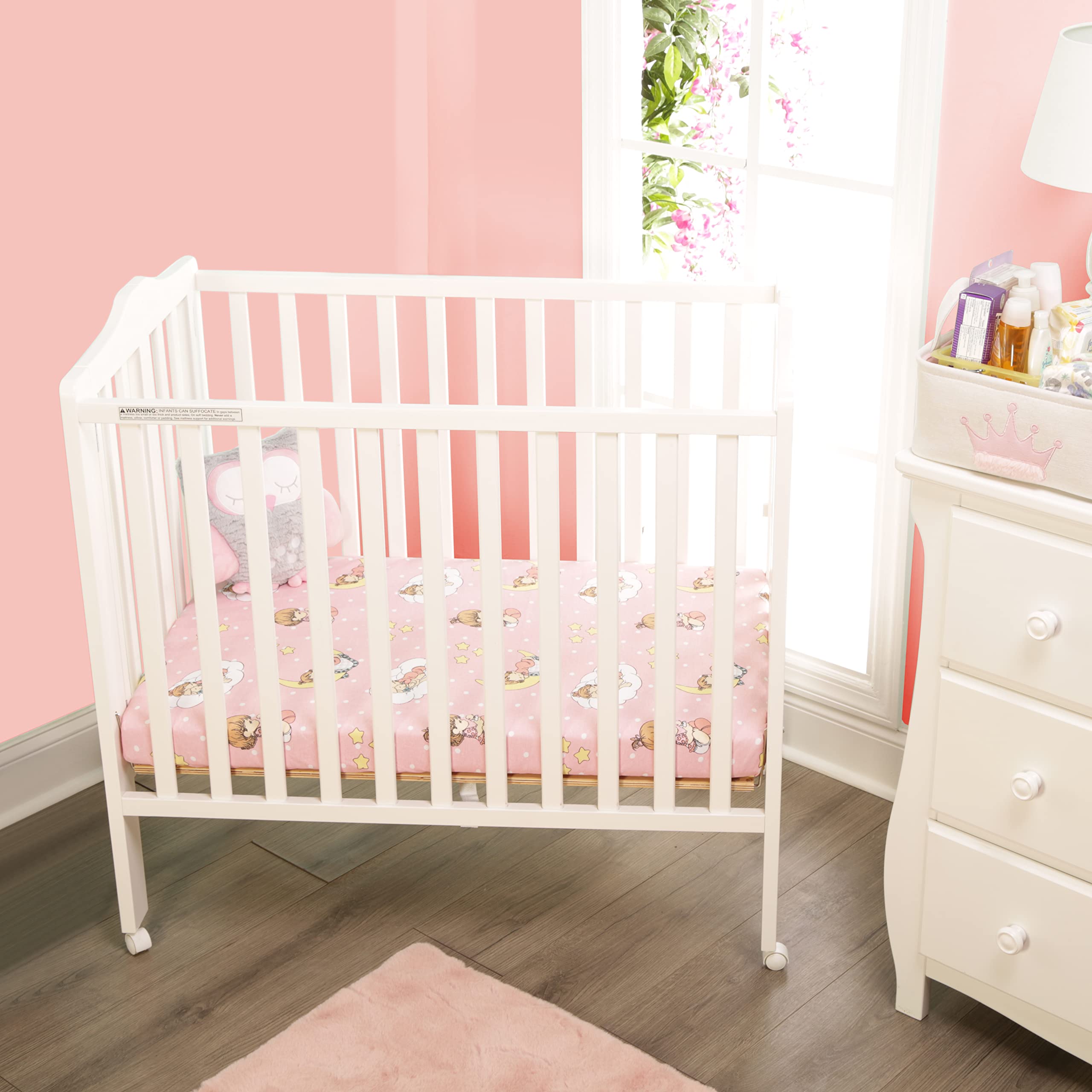 Everyday Kids pink solid sheet for pack n play with a 5-inch pocket.