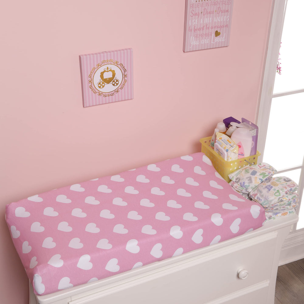 EVERYDAY KIDS changing pad cover two-pack layout displays stylish, coordinating nursery decor options